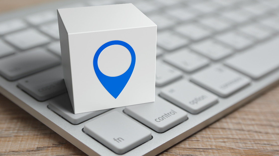 blue map marker on top of keyboard, why local seo matters