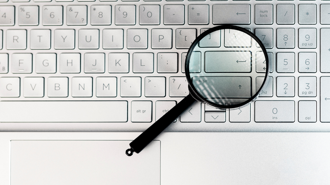 Magnifying Glass on Computer Keyboard, What is Meant by Search Engine Marketing
