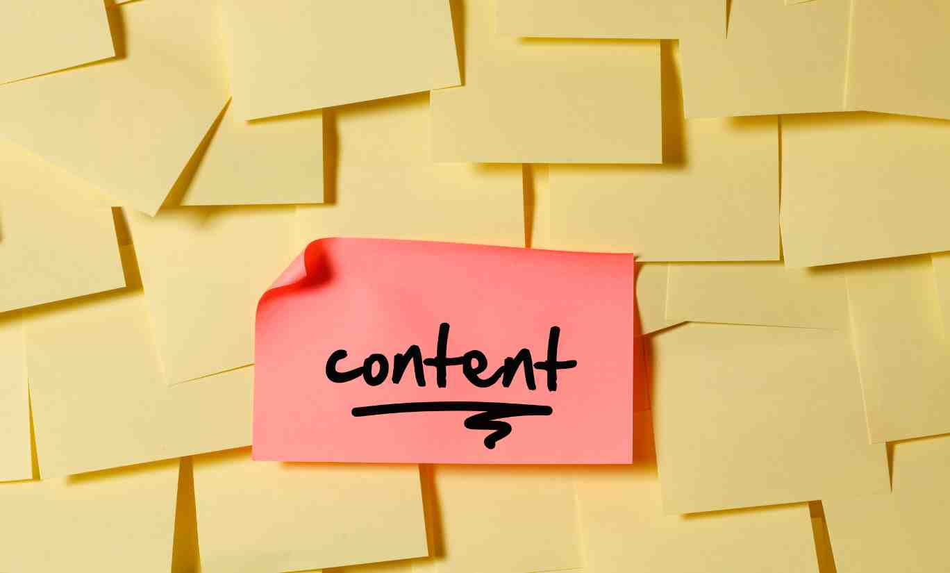 The Importance of Content in SEO - collection of post it notes, one pink post it with content written